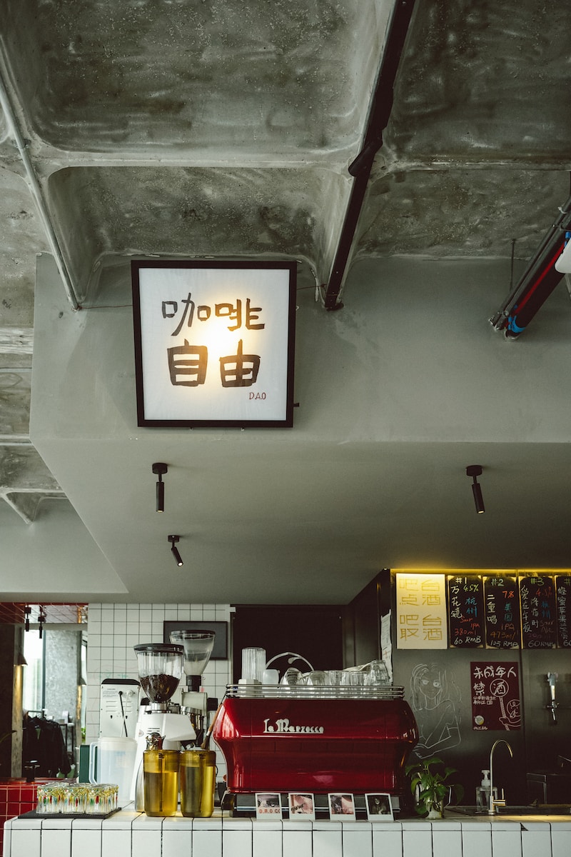 a sign hanging from the ceiling of a restaurant