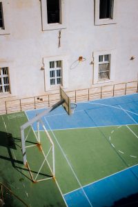 a basketball court in front of a building